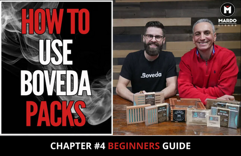 Boveda humidity packs beside an open humidor of premium cigars, showing how to use Boveda packs